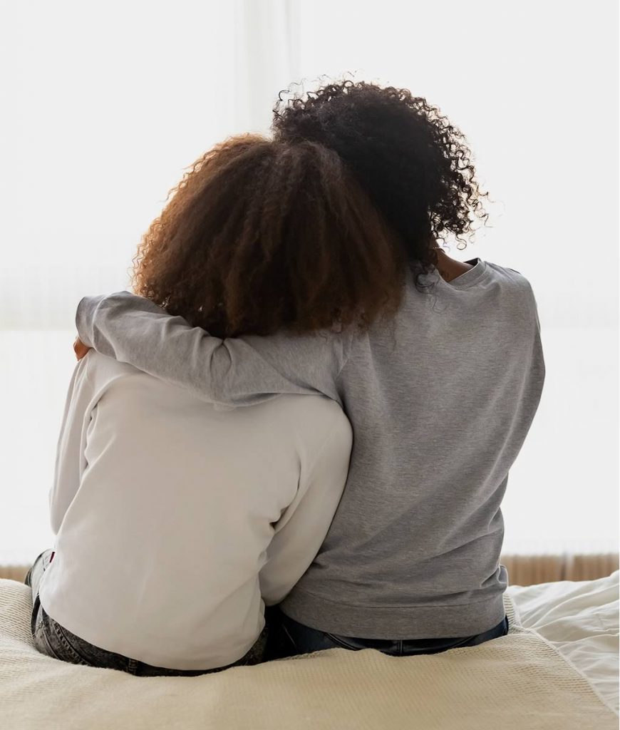 Image of a mother comforting her daughter
